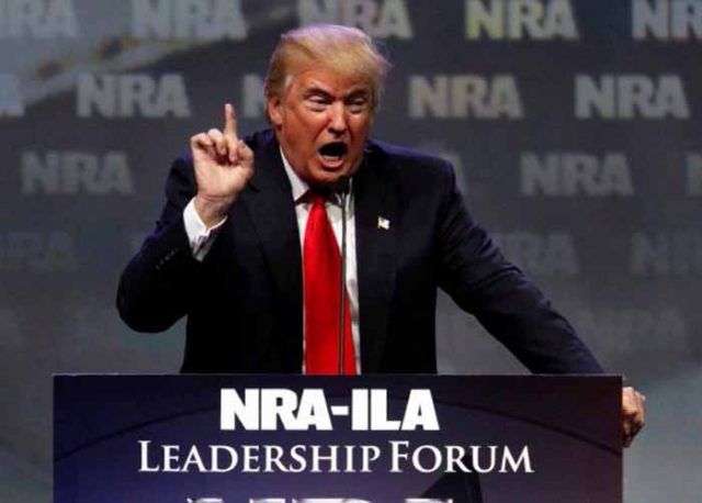 Republican presidential candidate Donald Trump addresses members of the National Rifle Association during their NRA-ILA Leadership Forum during at their annual meeting in Louisville